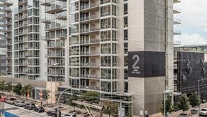A high-rise residential building with multiple balconies and large windows. - Austin Legendary 1BD 1BA 2nd Street District Apartment (Austin)