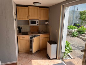 Fridge, microwave, stovetop, coffee/tea maker