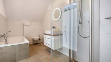 Bathtub, hair dryer, towels