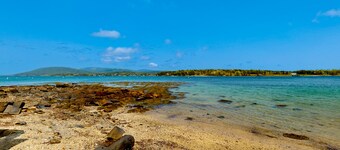 Enchanting dog-friendly ocean view home with kitchen, grill, balcony, TV, & deck