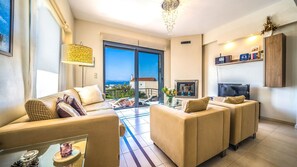 Älytelevisio, takka, DVD-soitin, kirjoja