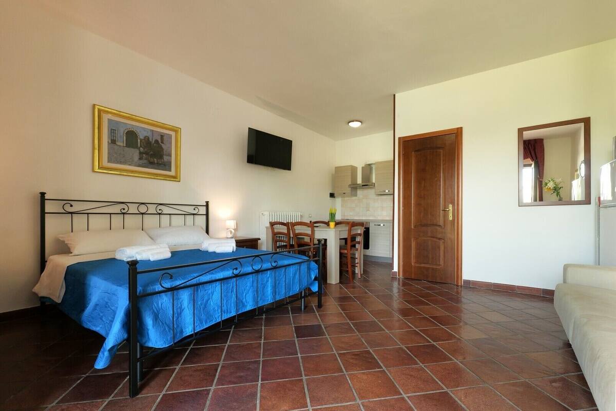 Family Studio, Pool View | Living area | 43-inch LED TV with digital channels, TV