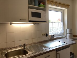 Fridge, microwave, stovetop, coffee/tea maker