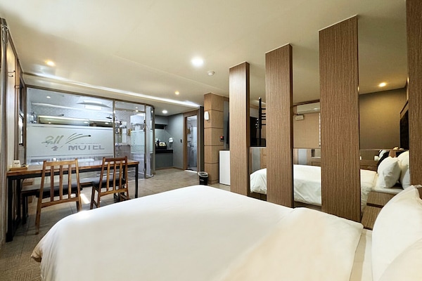 Family Room | Premium bedding, memory foam beds, desk, laptop workspace