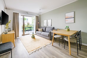 One-Bedroom Suite with balcony | Living area | 50-inch Smart TV with satellite channels, TV - Limehome Budapest Mosonyi u. 4 (Budapest)