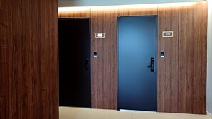 A hotel room with two doors, each marked with a number. - Lagobaum Hotel (Sejong)