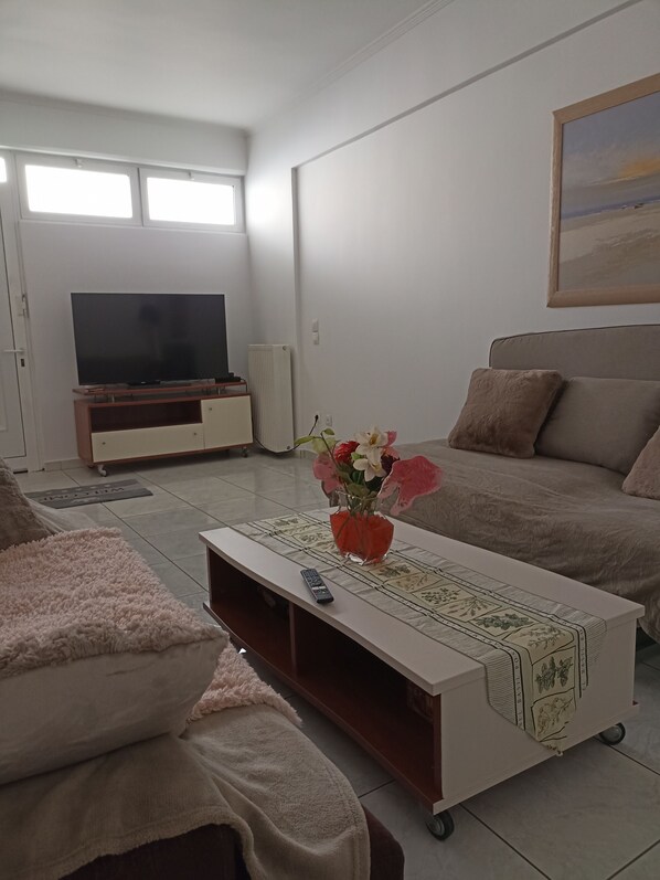 Departamento, varias camas | Área de sala de estar