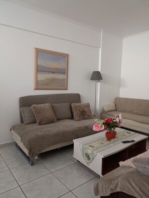 Departamento, varias camas | Área de sala de estar