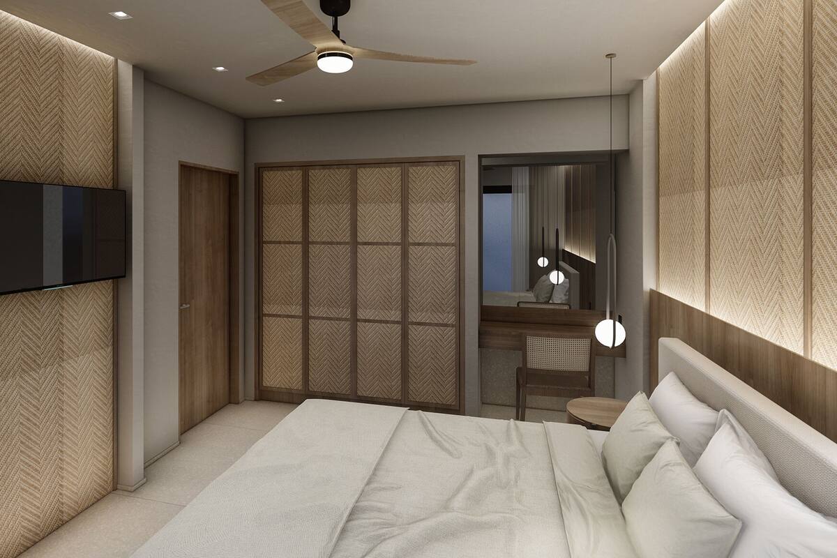 A modern bedroom with a bed, a TV, a ceiling fan, and a wardrobe.