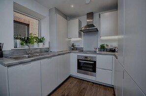 Apartment, 2 Queen Beds | Private kitchen | Fridge, microwave, oven, stovetop