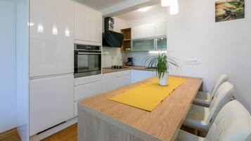 Apartment | Private kitchen | Full-size fridge, oven, dishwasher, electric kettle