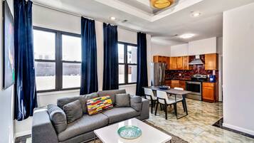 Basic Apartment, Multiple Beds | Living area | Smart TV