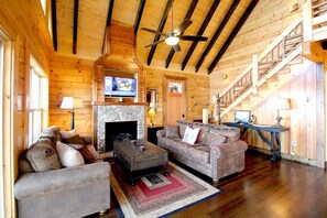 Télévision à écran plat, cheminée, baby-foot