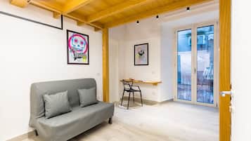 Monolocale City | Area soggiorno | TV 35 pollici con canali digitali