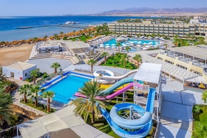 A resort with a large swimming pool, water slides, and a beach area. - Seven Seas Jolie Bay - Ultra All Inclusive (Safaga)