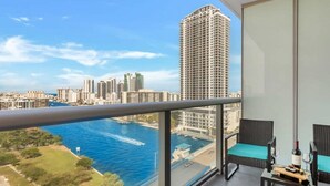 A balcony with a view of a city skyline and a body of water. - Spectacular View w/Balcony+Pool|Near Beach (Hallandale Beach)