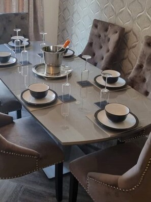 Enjoy meals in this dining area with a long table and six comfortable chairs.