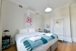 1 bedroom, desk, iron/ironing board, travel crib