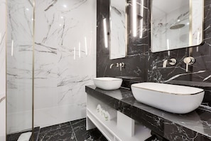 Shower, hair dryer, towels, shampoo