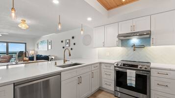 Condo, Multiple Beds, Balcony | Private kitchen | Fridge, microwave, oven, stovetop