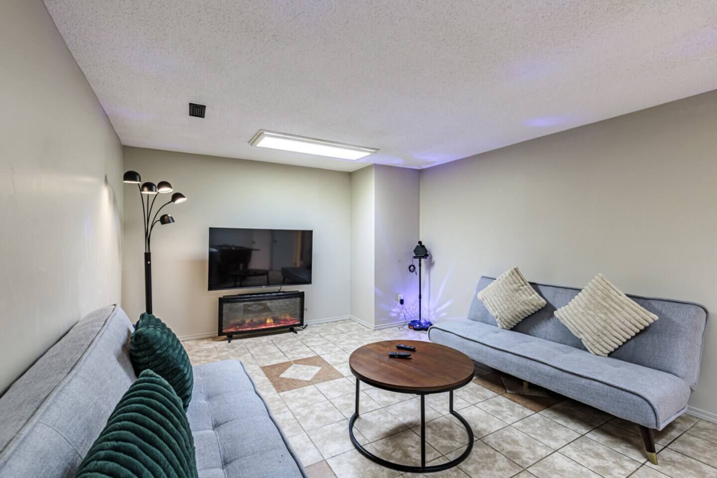 Entertainment Room showing Sofa-beds, 55" Roku TV, Karaoke Machine