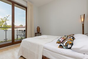 Apartment, 1 Bedroom, Balcony | 1 bedroom, bed sheets