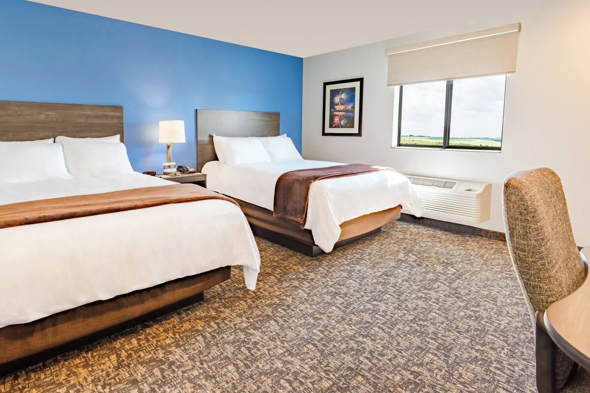 Premium bedding, pillow-top beds, desk, laptop workspace