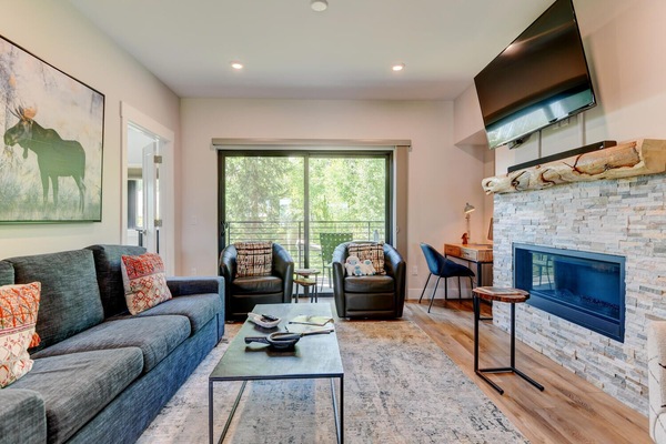 Living Room Area With 55" Smart TV and Gas Fireplace