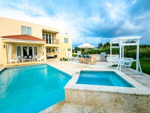 Outdoor pool - Tropical Retreat Stay-Spacious 5BR Oasis with Pool, Solar Backup, for 20 Guests! (caimital alto)