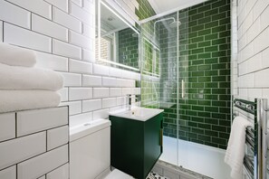 Shower, rainfall showerhead, hair dryer, towels