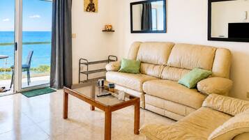Family Apartment, 2 Bedrooms, Balcony (Seafront apartment in Gozo,) | Living area | TV