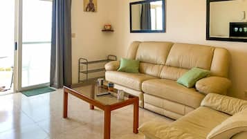 Family Apartment, 2 Bedrooms (Seafront apartment in Gozo,) | Living room | 21-inch TV with cable channels