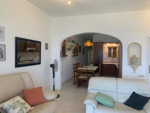 Family Apartment, Multiple Bedrooms (Seafront apartment in Gozo,) | Living room | 21-inch TV with cable channels - Seafront apartment in Gozo, Marsalforn (Zebbug)