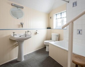 A bathroom with a pedestal sink, toilet, and window. - St Samson (Port Isaac)