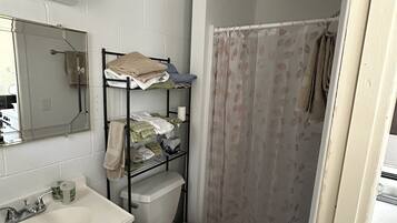 Shower, hair dryer, towels, soap