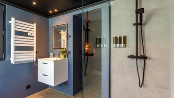 Shower, jetted tub, hair dryer, bathrobes