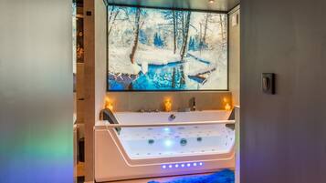 Shower, jetted tub, hair dryer, bathrobes