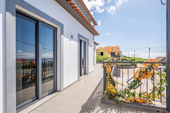 Enjoy expansive views from the large windows and relax on the balcony.