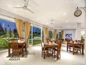 Enjoy meals in this stylish dining area with a large table and comfortable seating.
