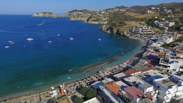 An aerial view of a coastal town with a beach, boats, and buildings. - Apartments for 3 2nd Floor (Malevizi)
