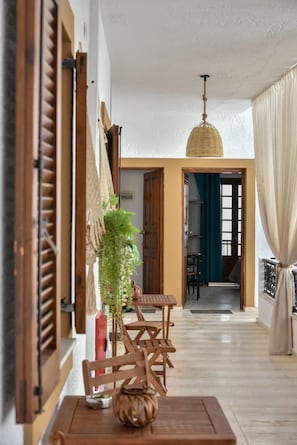 Enjoy a spacious living area with a dining table, seating area, and connecting doorway.