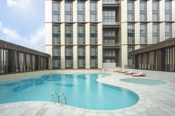 Seasonal outdoor pool, open 6:00 AM to 11:00 PM, pool umbrellas