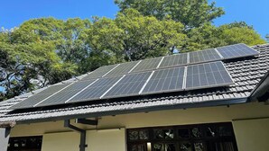 A building with a solar panel array on the roof. - Cozy 3 Bedroom House With Unique Bathrooms - 2084 (Bulawayo)