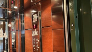An elevator with a digital display, a keypad, and a sign indicating it is a fire elevator. - Adelais in Piraeus With 1 Bedrooms and 1 Bathrooms (Piraeus)
