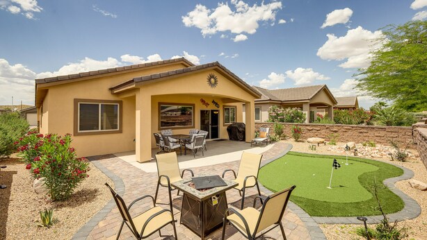 A residential property with a patio, outdoor seating, and a putting green. - Mesquite Vacation Rental - Close to Golf Courses! (Mesquite)