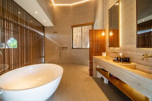 Bathtub, hair dryer, towels, soap