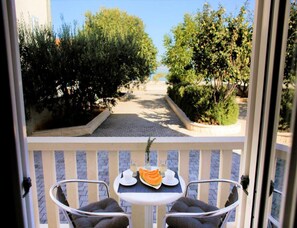 Enjoy a meal on the balcony with a view of the beautifully manicured grounds.