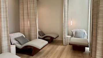 Relax in a serene space with a seating area and a small side table.