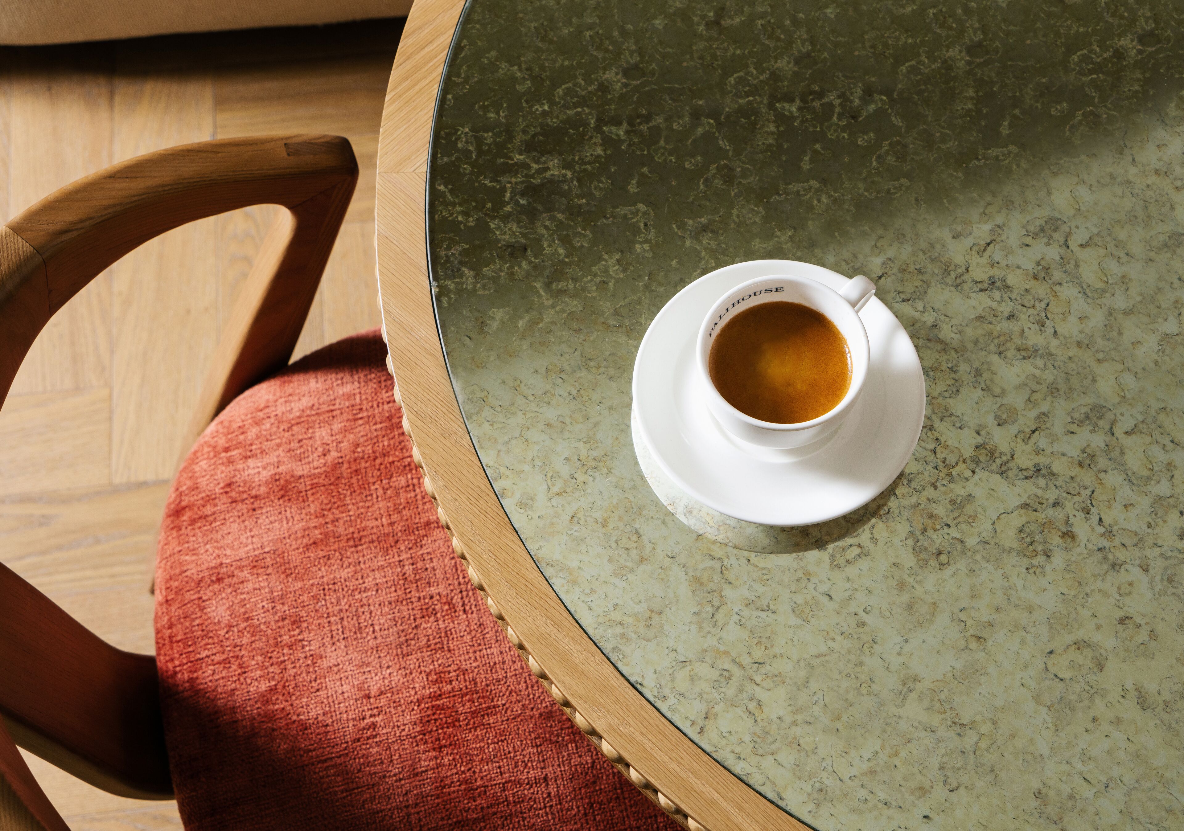 A round table with a cup of coffee on it.
