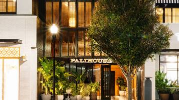 A building with a sign reading "HYDE PARK VILLAGE" and "PALIHOUSE".